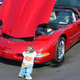 Illustration for article titled Why do car collectors put creepy dolls on their bumpers?